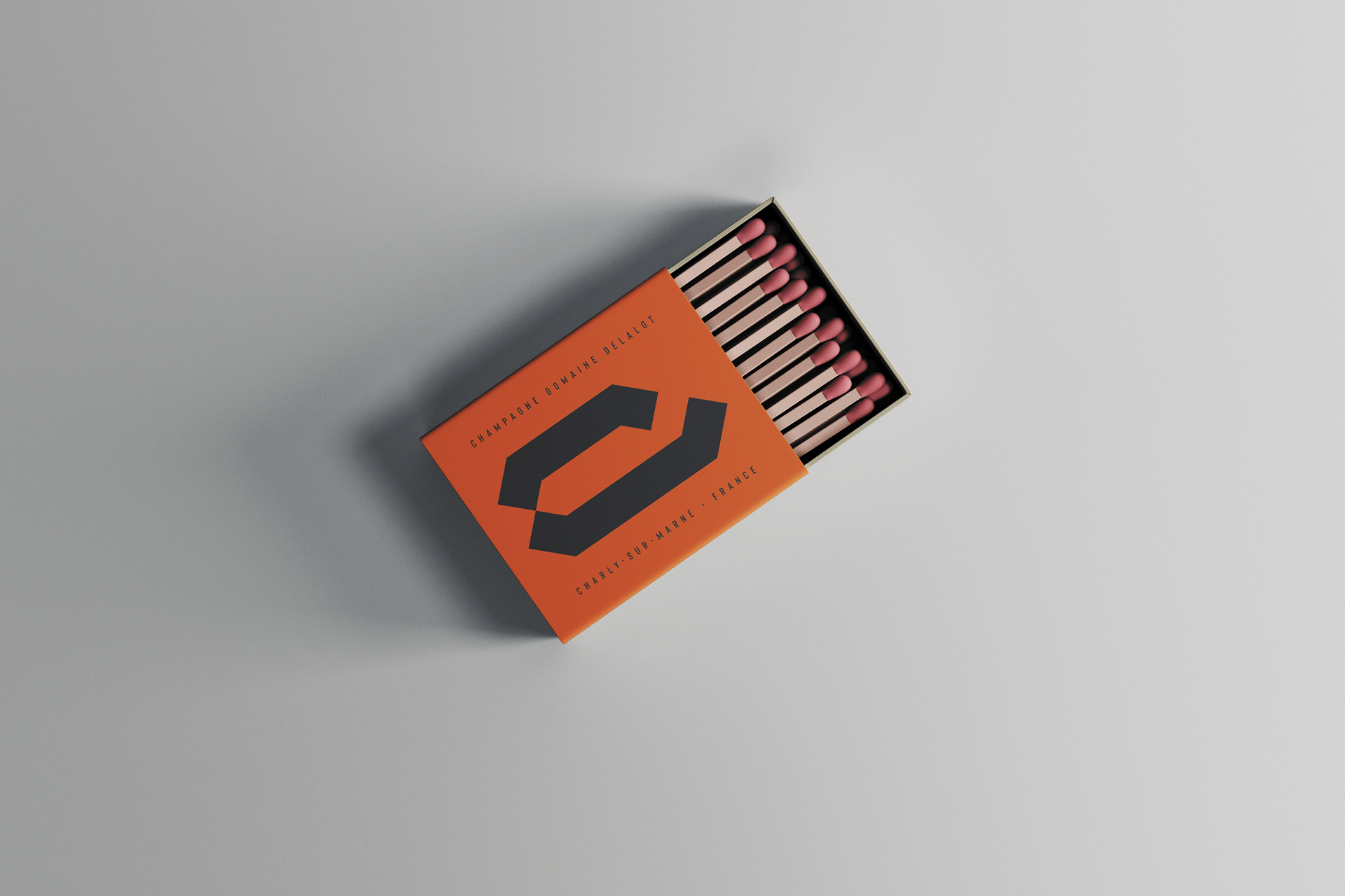 Identité visuelle et packaging haut de gamme pour le champagne Delalot, avec logo élégant, typographie raffinée et design graphique sophistiqué reflétant prestige et exclusivité de la marque